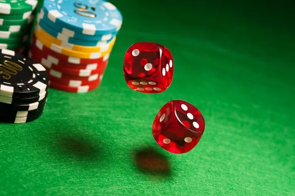 Live Dice Game table at dollar toto with dealer rolling physical dice on HD camera